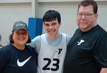 Kolten with Coach Tim and Raquel Fry.