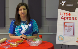 YMCA staff making cinnamon rolls