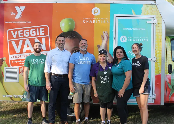 ymca representatives stand in front of Tampa Y Veggie Van