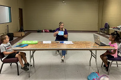 Y staff reading with children