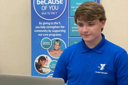 YMCA youth in government teen looking at a laptop