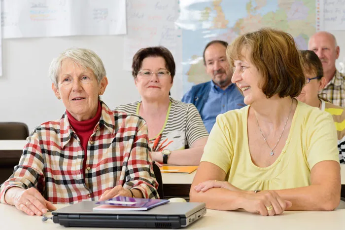 six seniors in a classroom setting