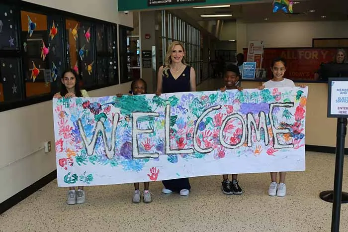 Congresswoman Laurel Lee and campers in the New Tampa YMCA lobby.
