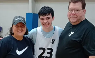 Kolten with Coach Tim and Raquel Fry.